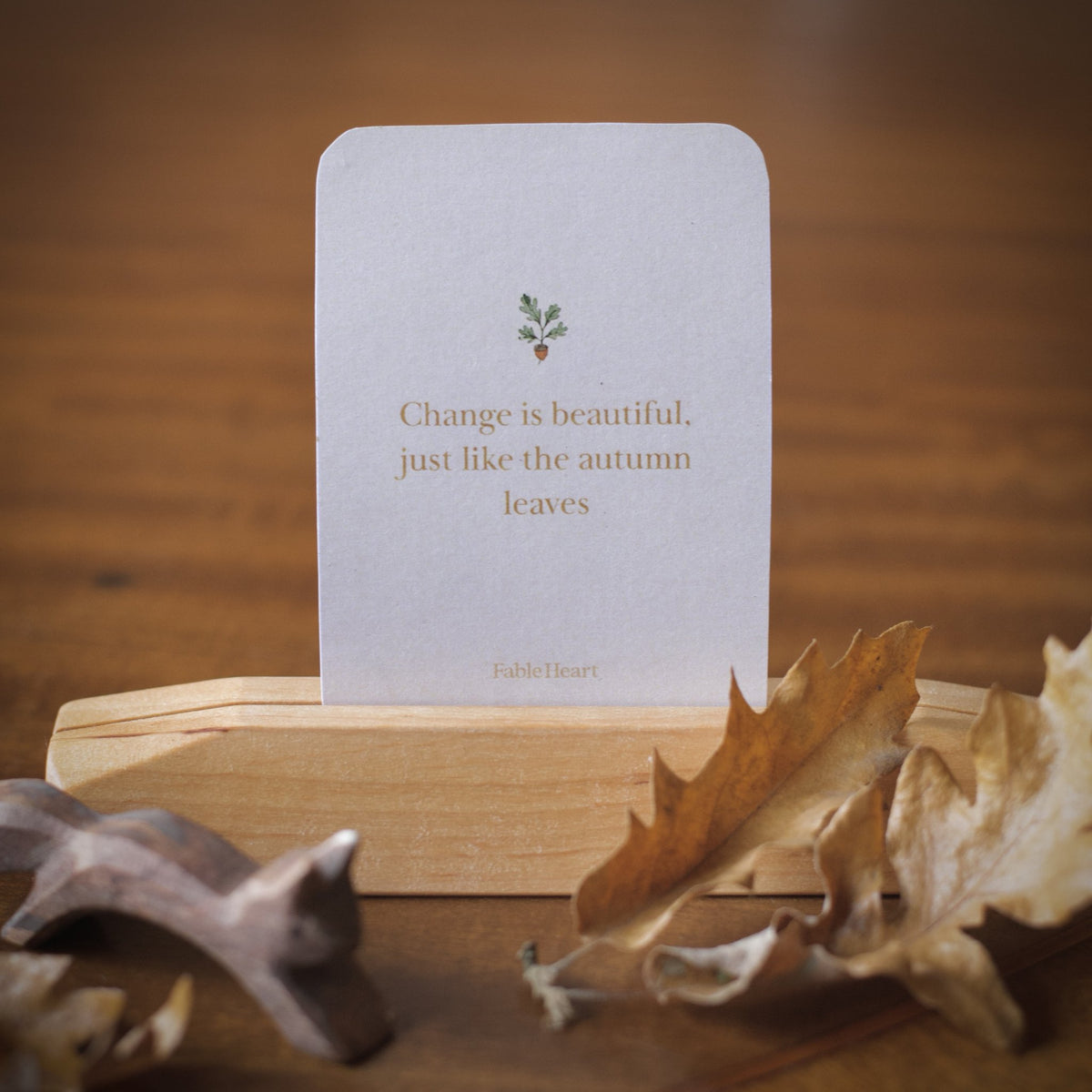 Autumn affirmation card, Change is beautiful just like the autumn leaves, on a wooden stand