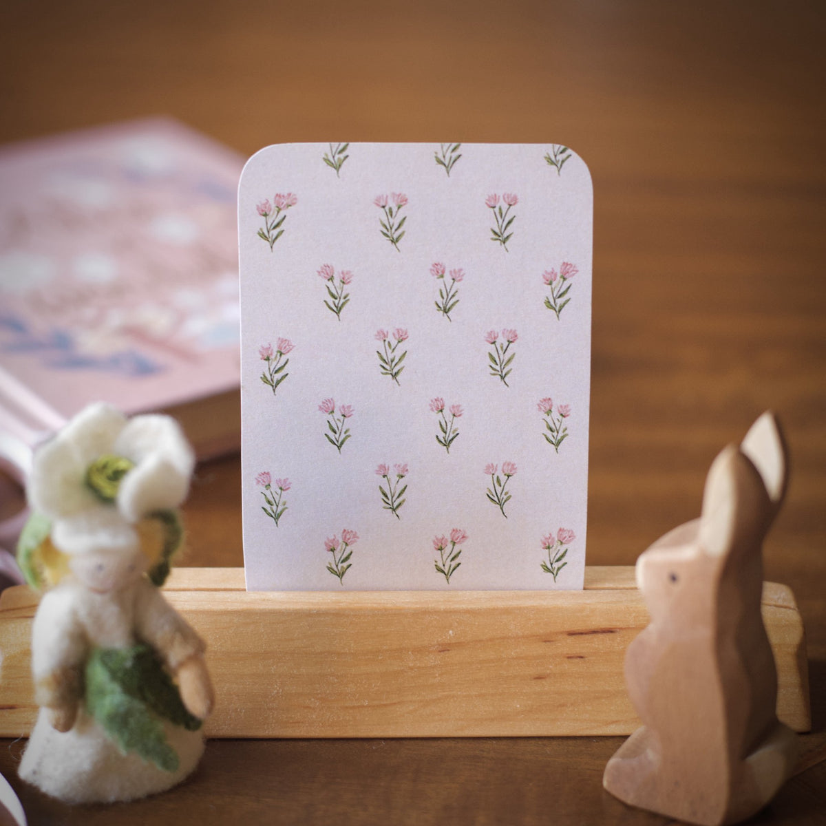 The pink flower pattern on the back of the spring affirmation cards