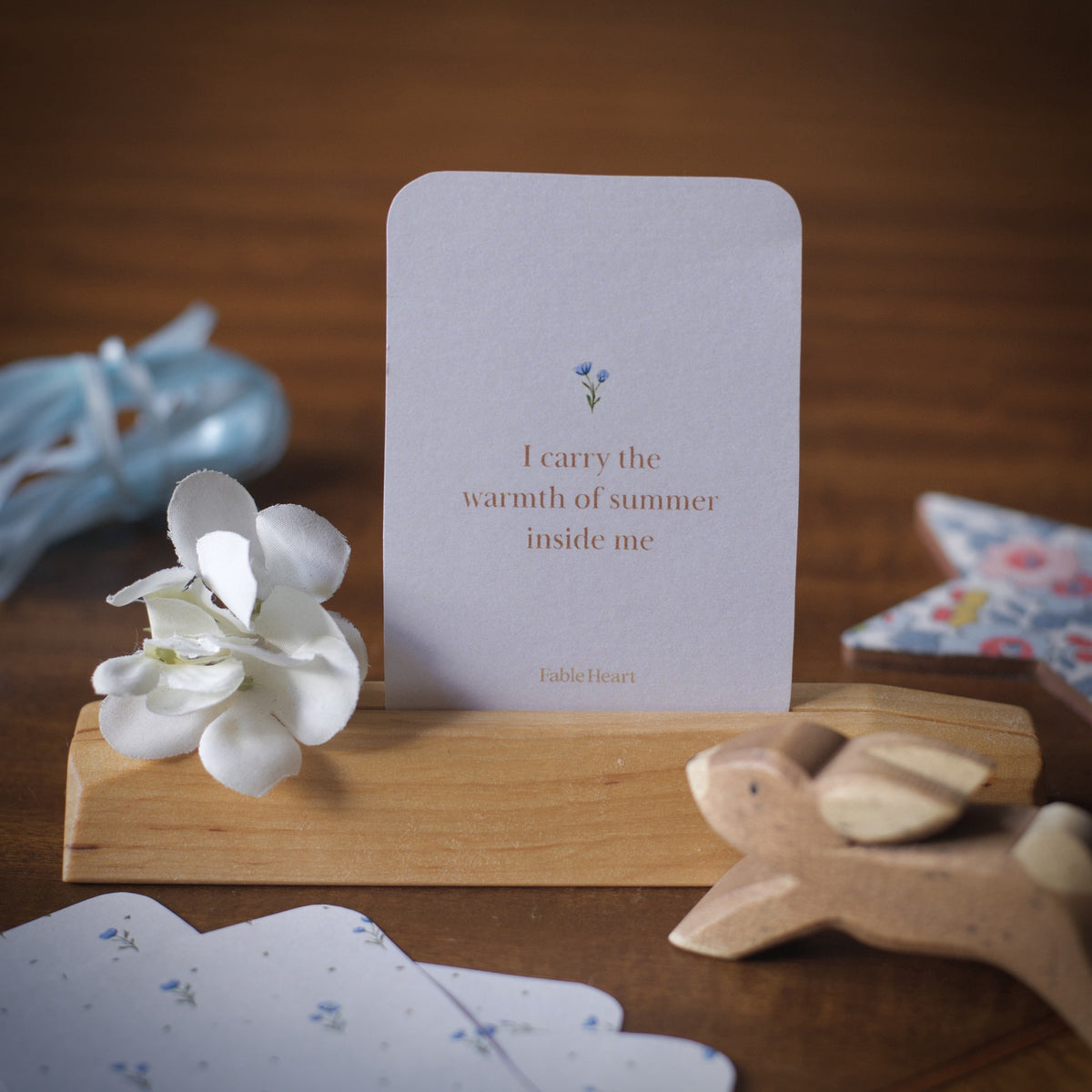Summer affirmation card, I carry the warmth of summer inside me, on a wooden stand